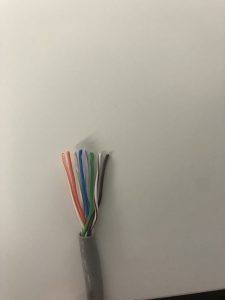 How to align RJ45 Wiring: Exposed RJ45 Wiring showing twisted pairs neatly aligned.