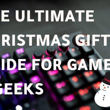 A photo of a keyboard with white background text saying 'The Ultimate Christmas Gift Guide for Gamers & Geeks'